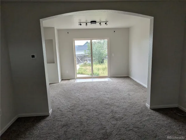 a view of a hallway with a window