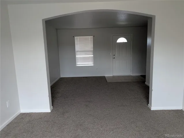 a kitchen with a refrigerator sink and stove