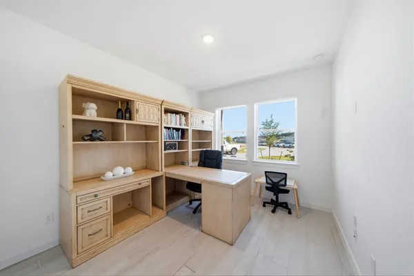 a view of a workspace with furniture