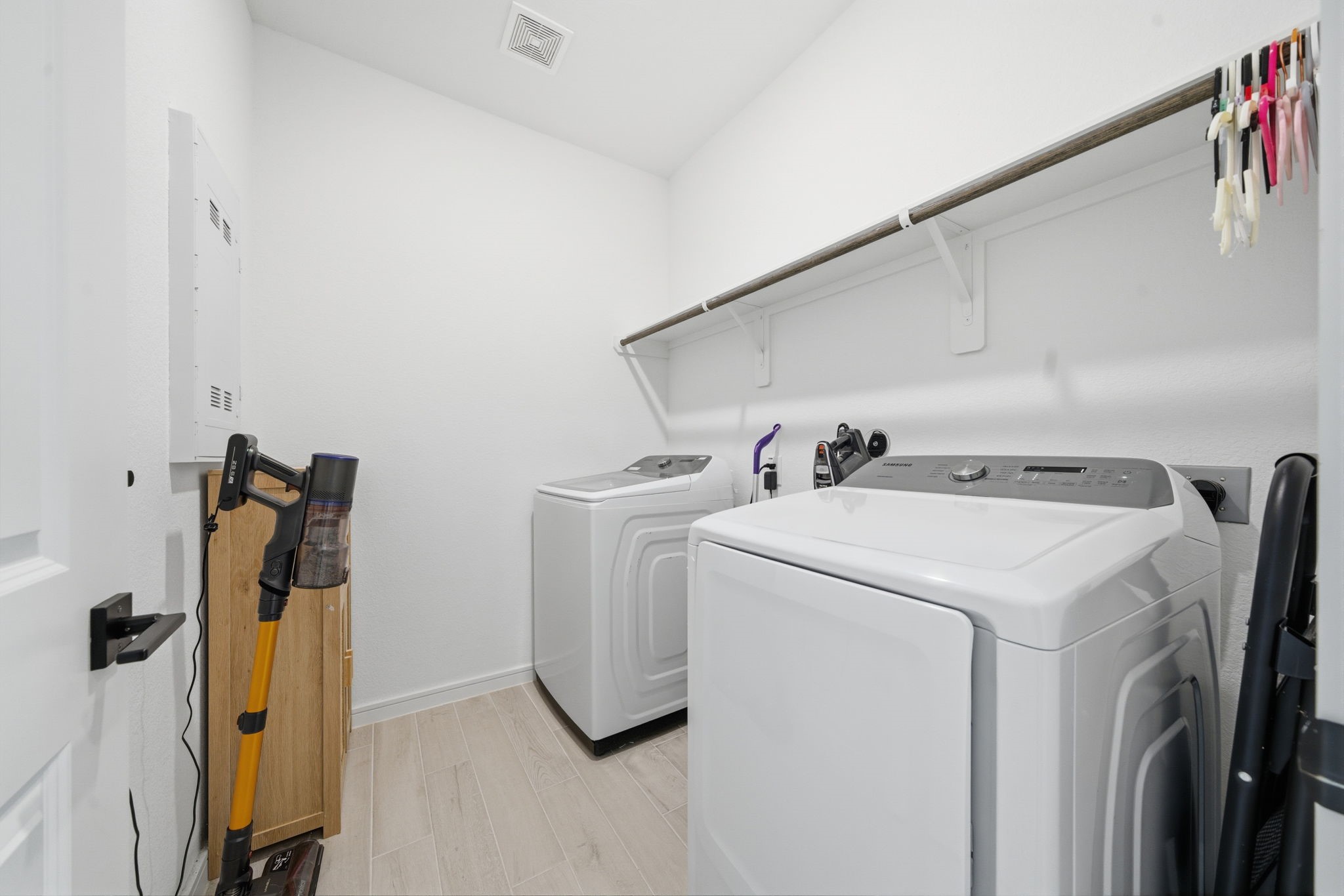 302 Alder Loop Anahuac, TX 77514 - Photo 28 of 34 A bright and functional laundry room a shelf above for storage, a simple and efficient layout.