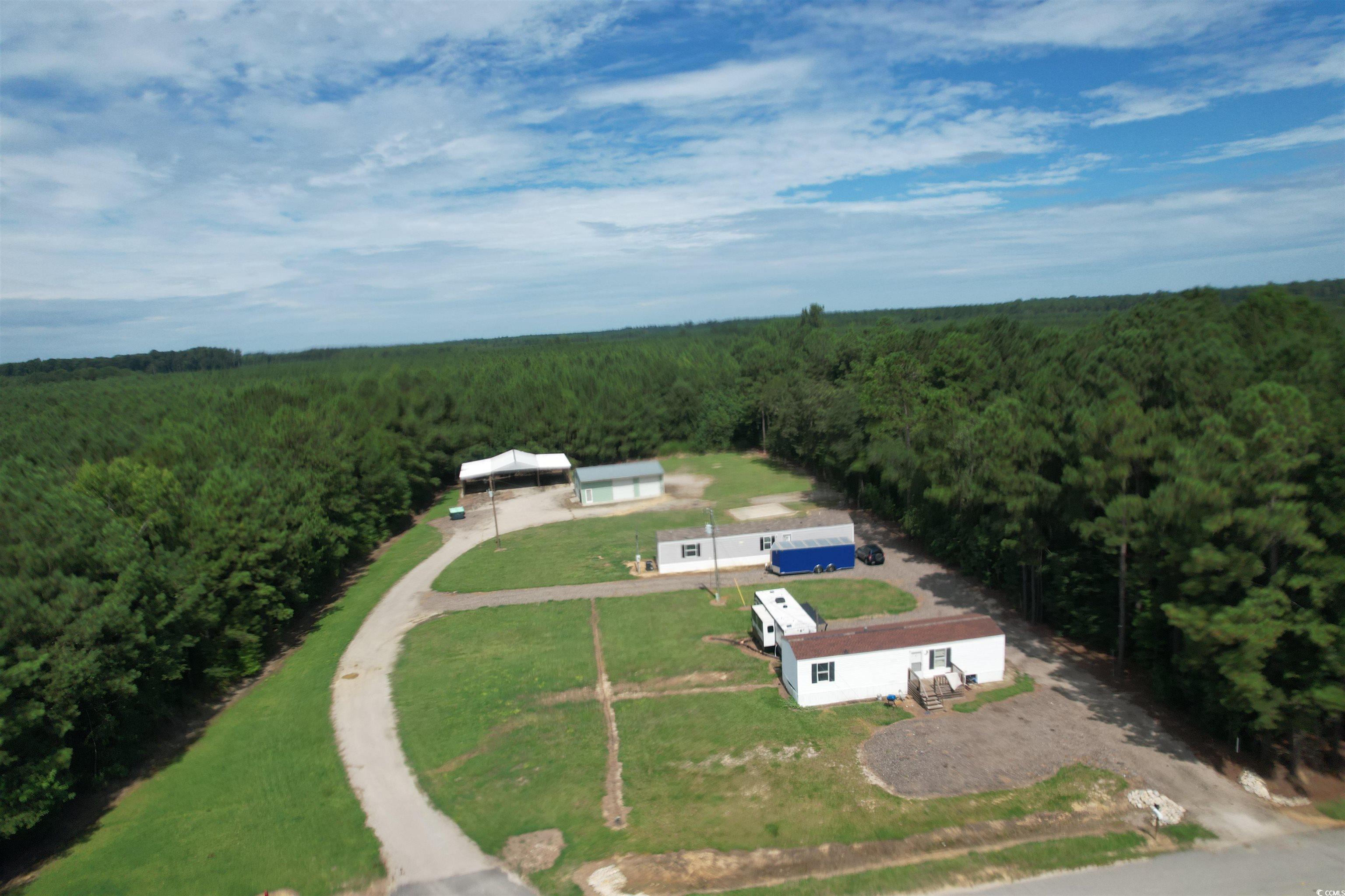 View from above of property featuring a forest