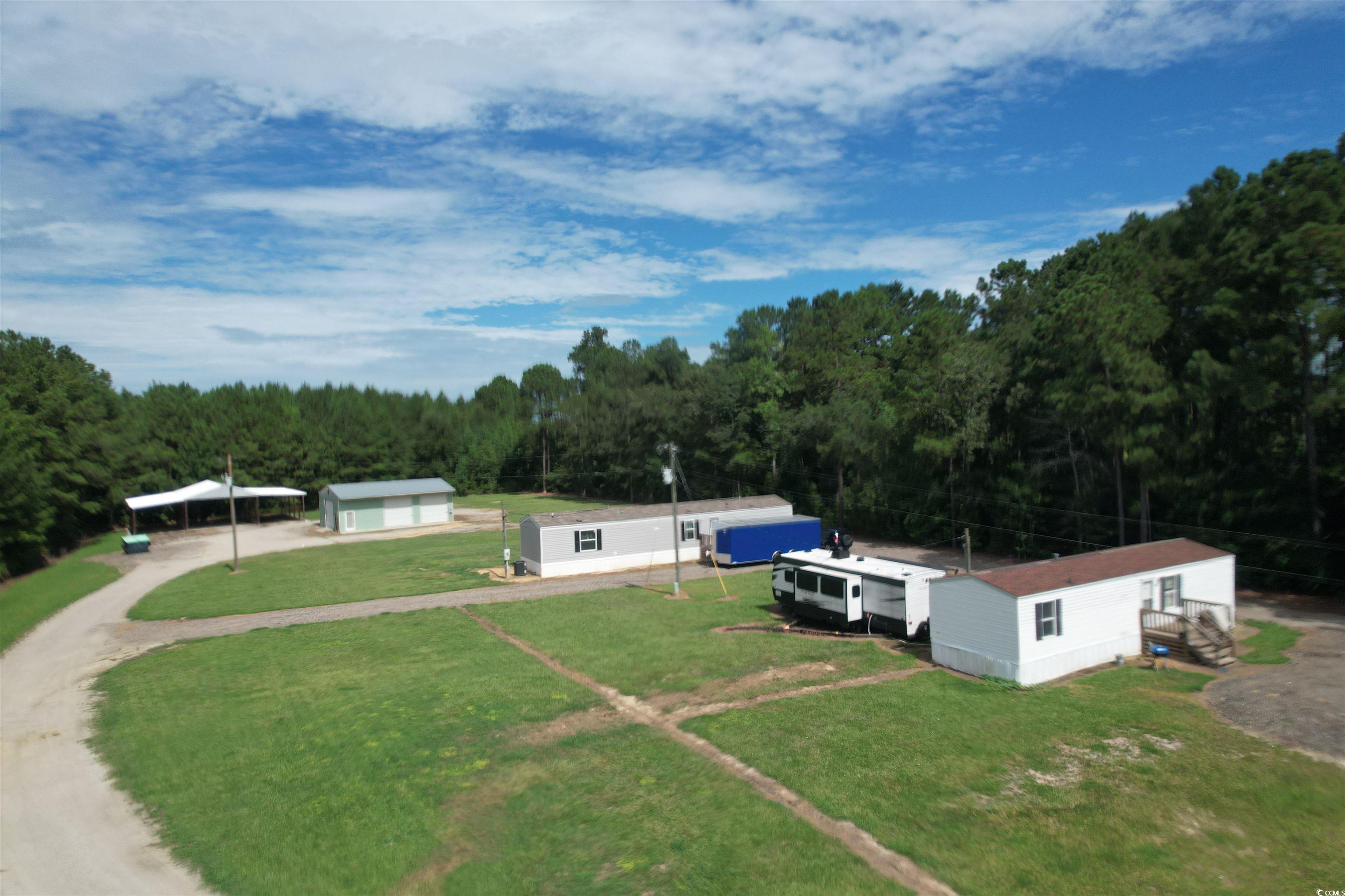 2433 Old Corner Court Marion, SC 29571 - Photo 2 of 18 Aerial view of property and surrounding area featuring a forest