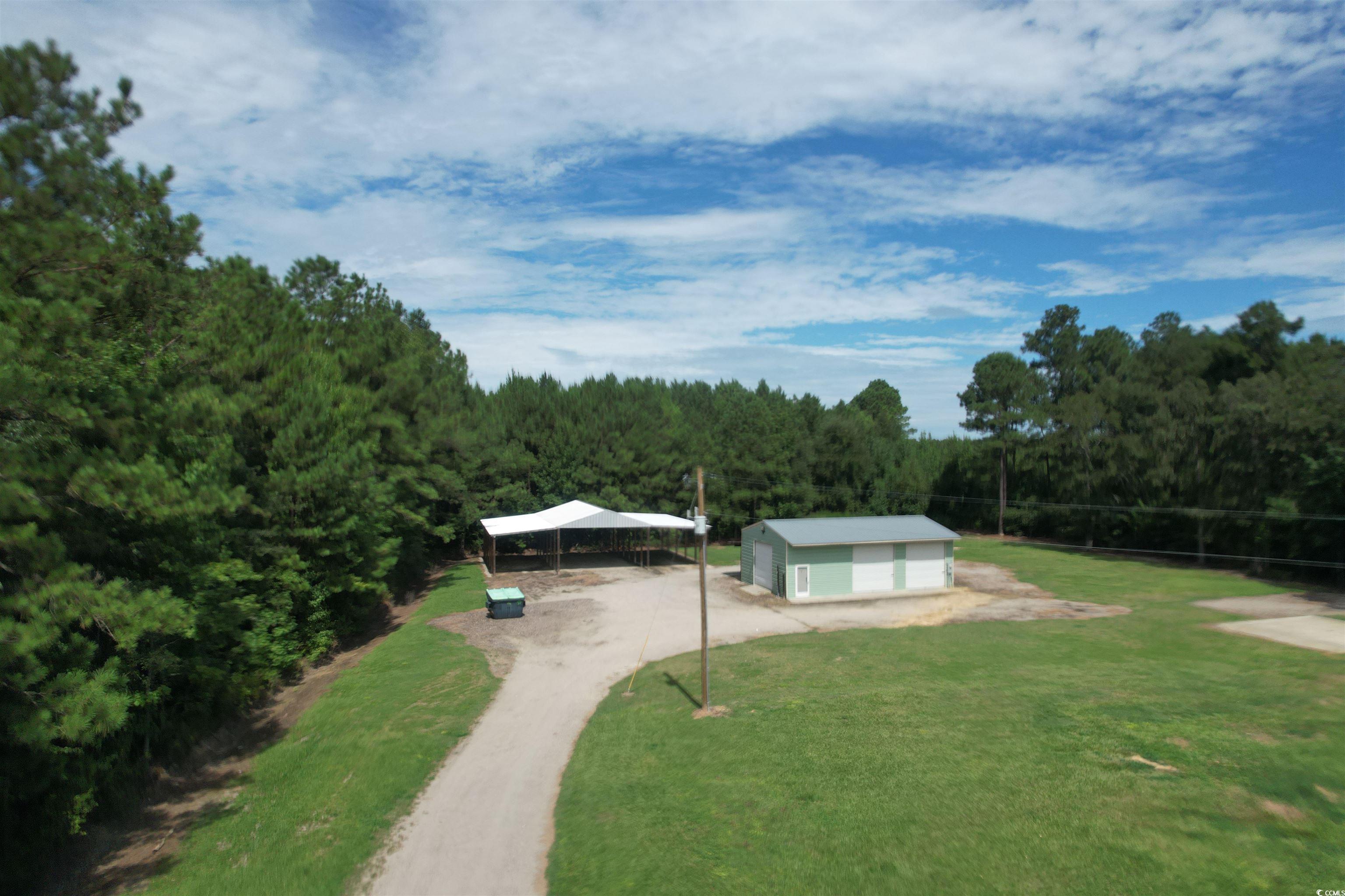 2433 Old Corner Court Marion, SC 29571 - Photo 3 of 18 Surrounding community with a wooded view and a lawn