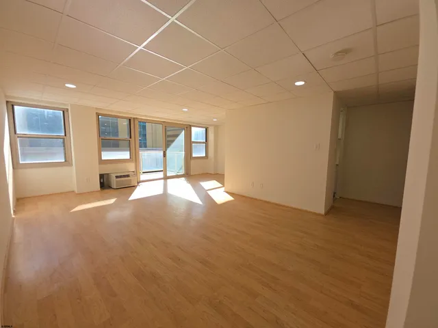 a view of empty room with a fireplace