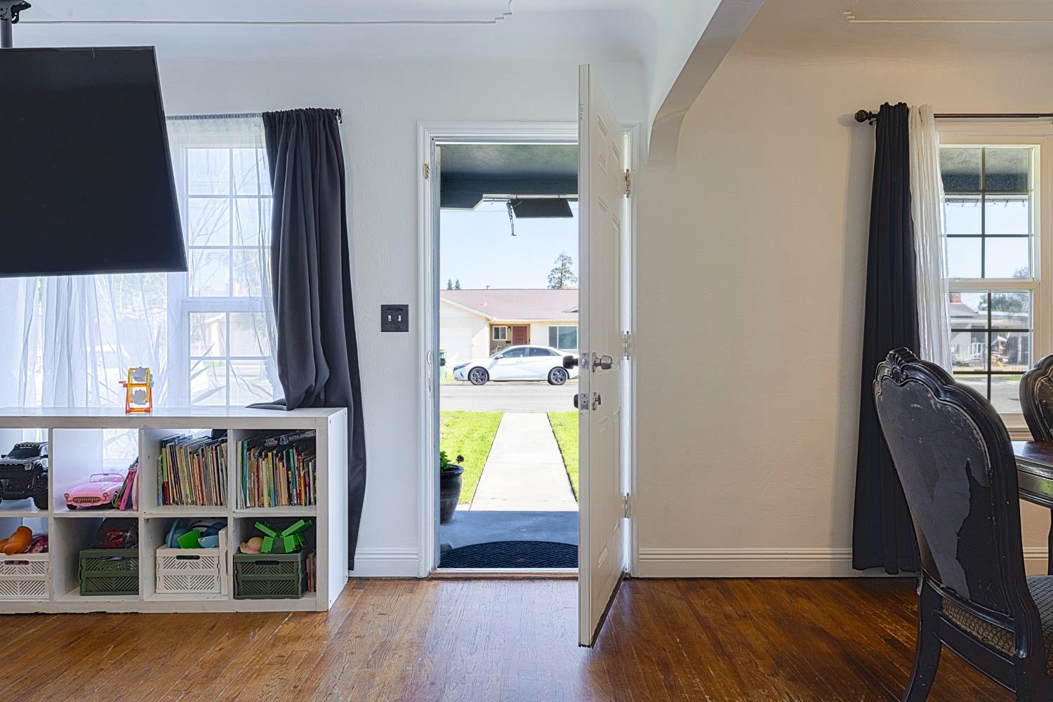 1030 Alpha Road Turlock, CA 95380 - Photo 5 of 25 hallway view with wooden floor and windows