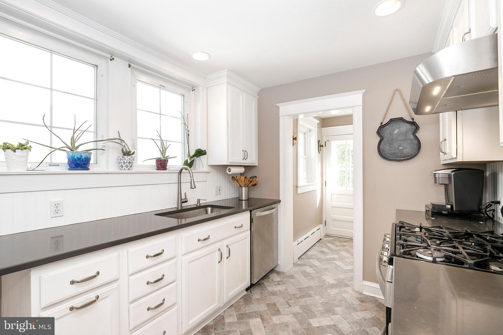 217 North Manoa Road Havertown, PA 19083 - Photo 14 of 47 Kitchen Herringbone Tile Floors