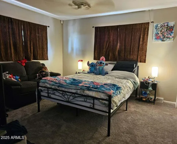 a bedroom with a bed and furniture