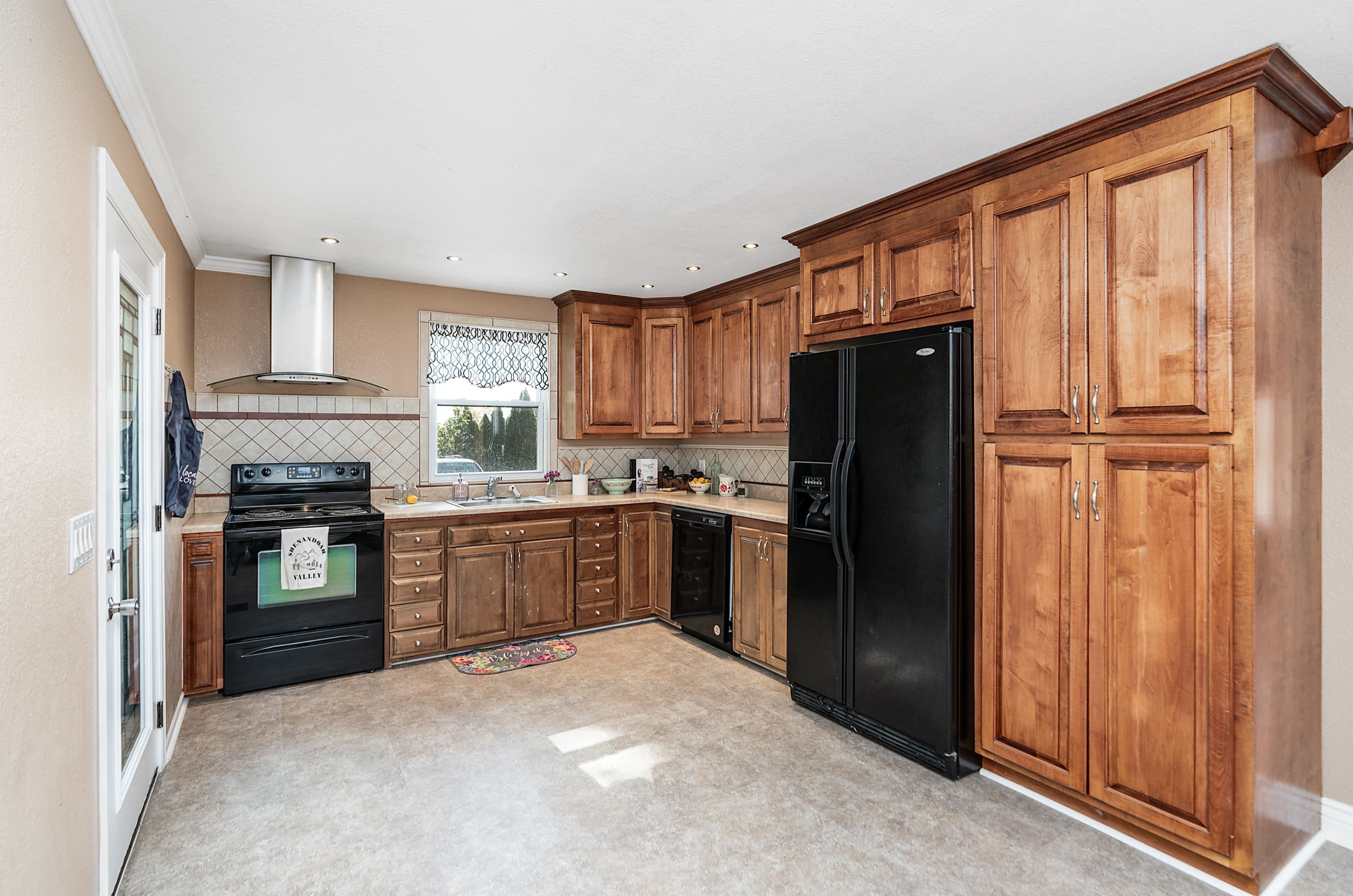3111 Oak Ridge Road Mount Crawford, VA 22841 - Photo 8 of 50 a kitchen with a refrigerator and a stove top oven
