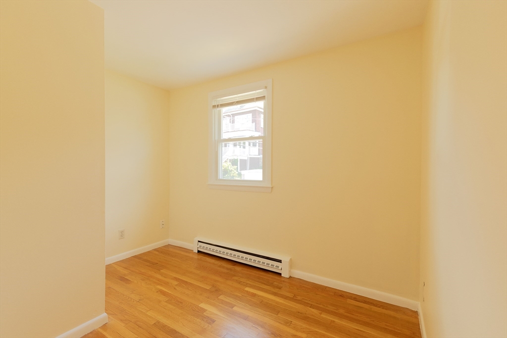 89 Brayton Road, Unit 2 Boston, MA 02135 - Photo 29 of 29 a view of a room with wooden floor and a window