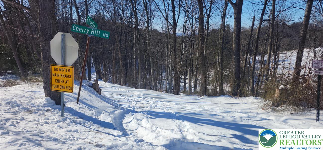 2199 Cherry Hill Road Parryville, PA 18071 - Photo 4 of 4 a view of a wooden fence with trees
