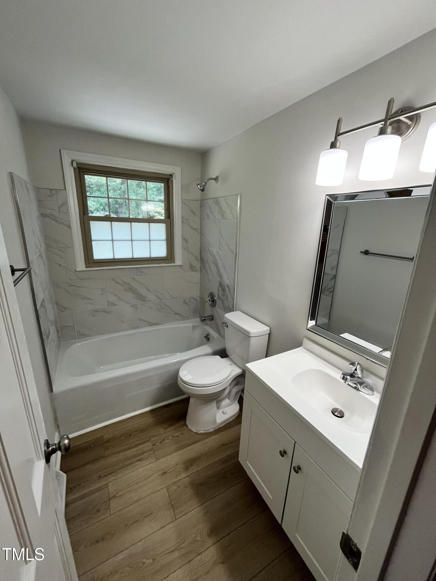 120 Dundee Road Fayetteville, NC 28303 - Photo 24 of 32 a bathroom with a double vanity sink toilet and shower