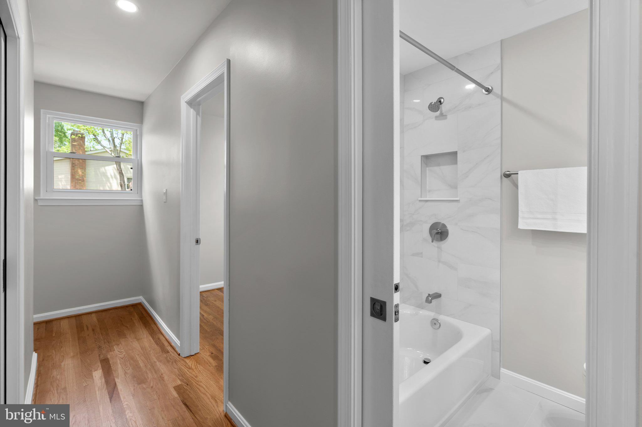 5525 Rolling Road Springfield, VA 22151 - Photo 22 of 89 a bathroom with a bathtub and a shower