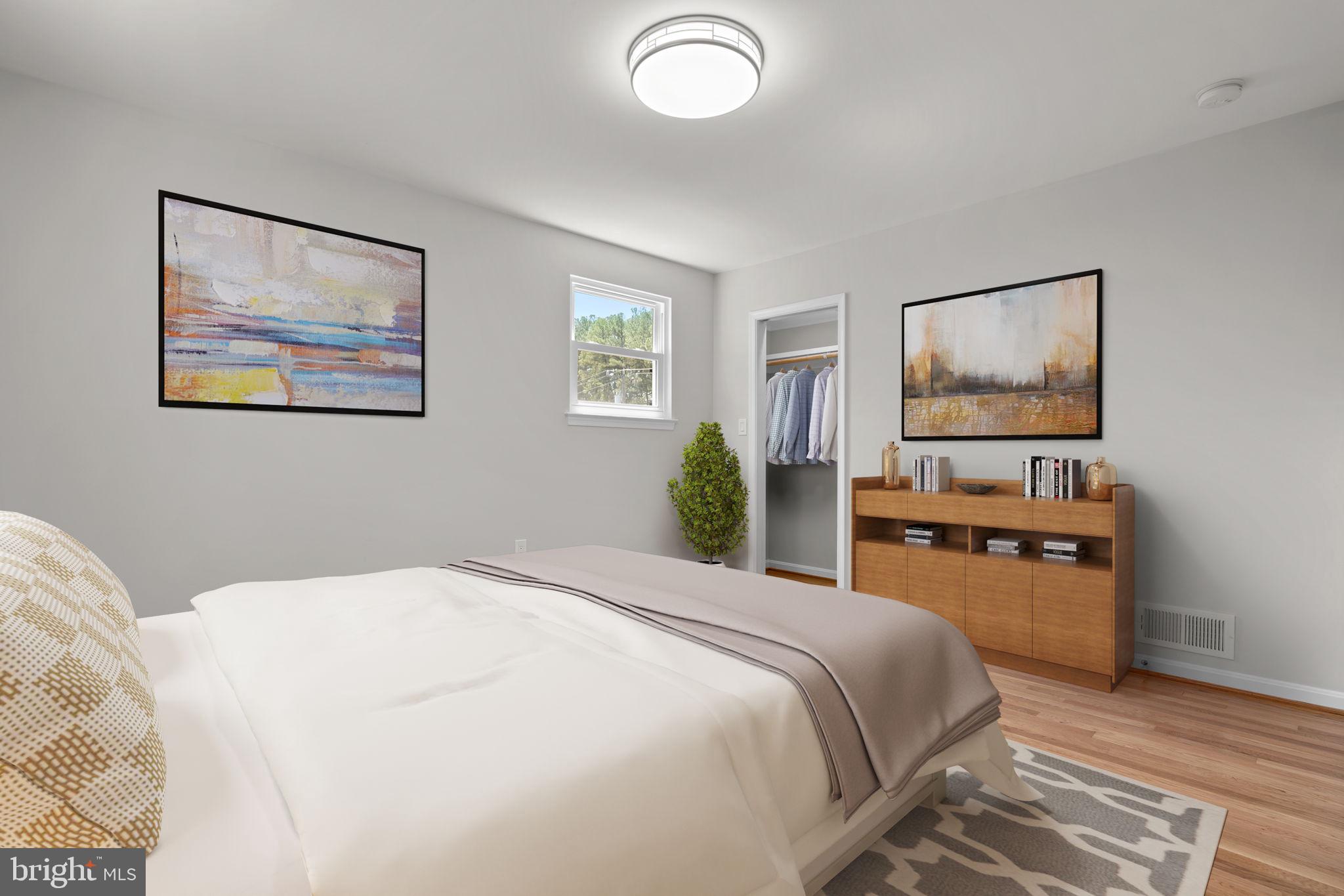 5525 Rolling Road Springfield, VA 22151 - Photo 26 of 89 a bedroom with a bed and a flat screen tv