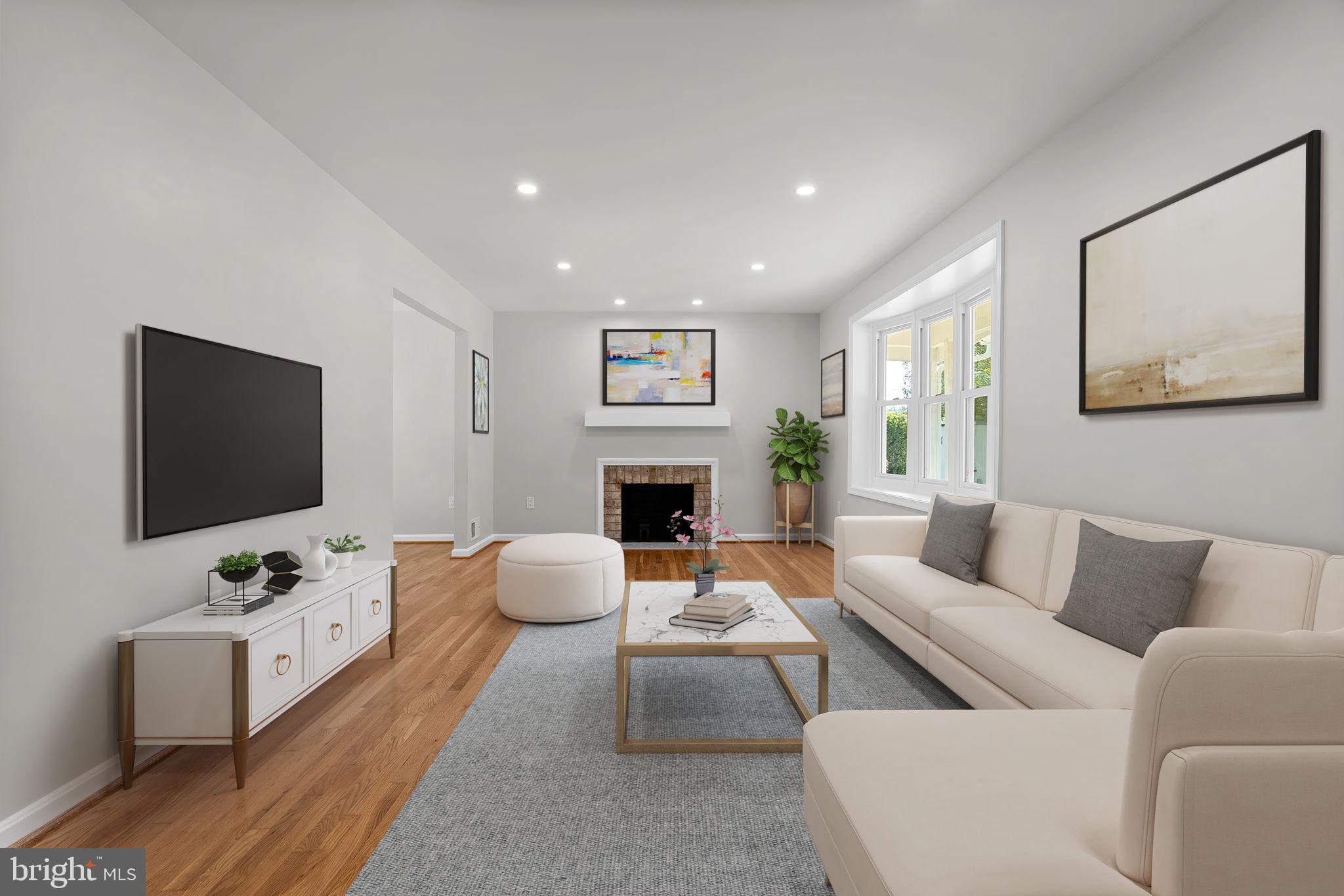 5525 Rolling Road Springfield, VA 22151 - Photo 5 of 89 a living room with furniture a flat screen tv and a fireplace
