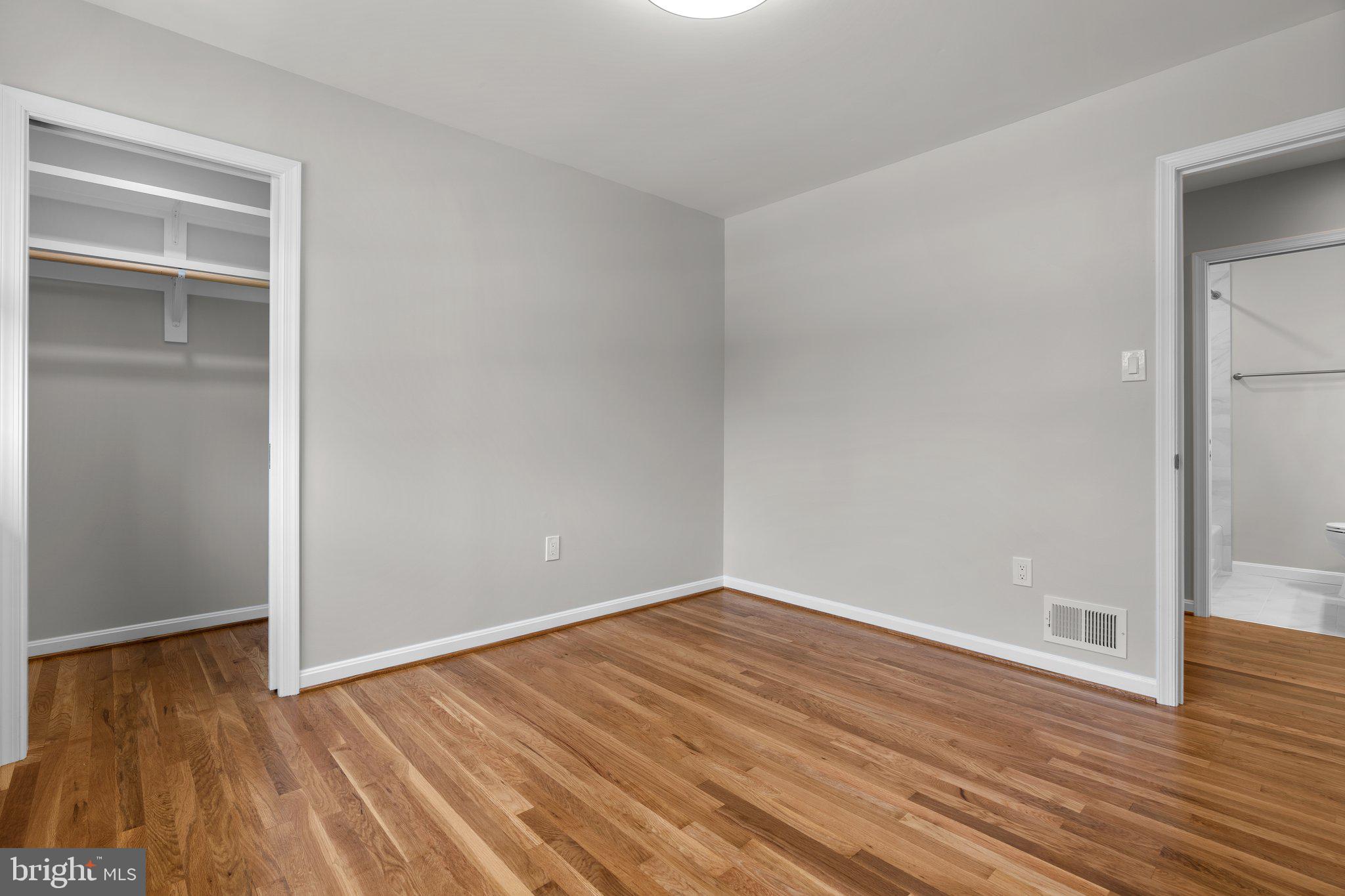 5525 Rolling Road Springfield, VA 22151 - Photo 79 of 89 a view of an empty room with wooden floor and a window