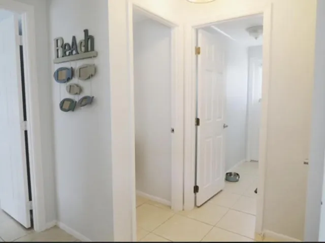a bathroom with a shower and a sink
