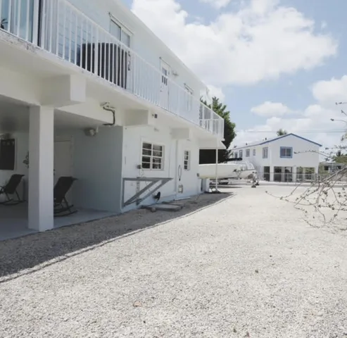a view of a street with roof and car parked