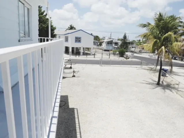 a view of a balcony with potted plants