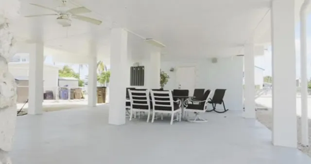 a view of a livingroom with furniture and a window
