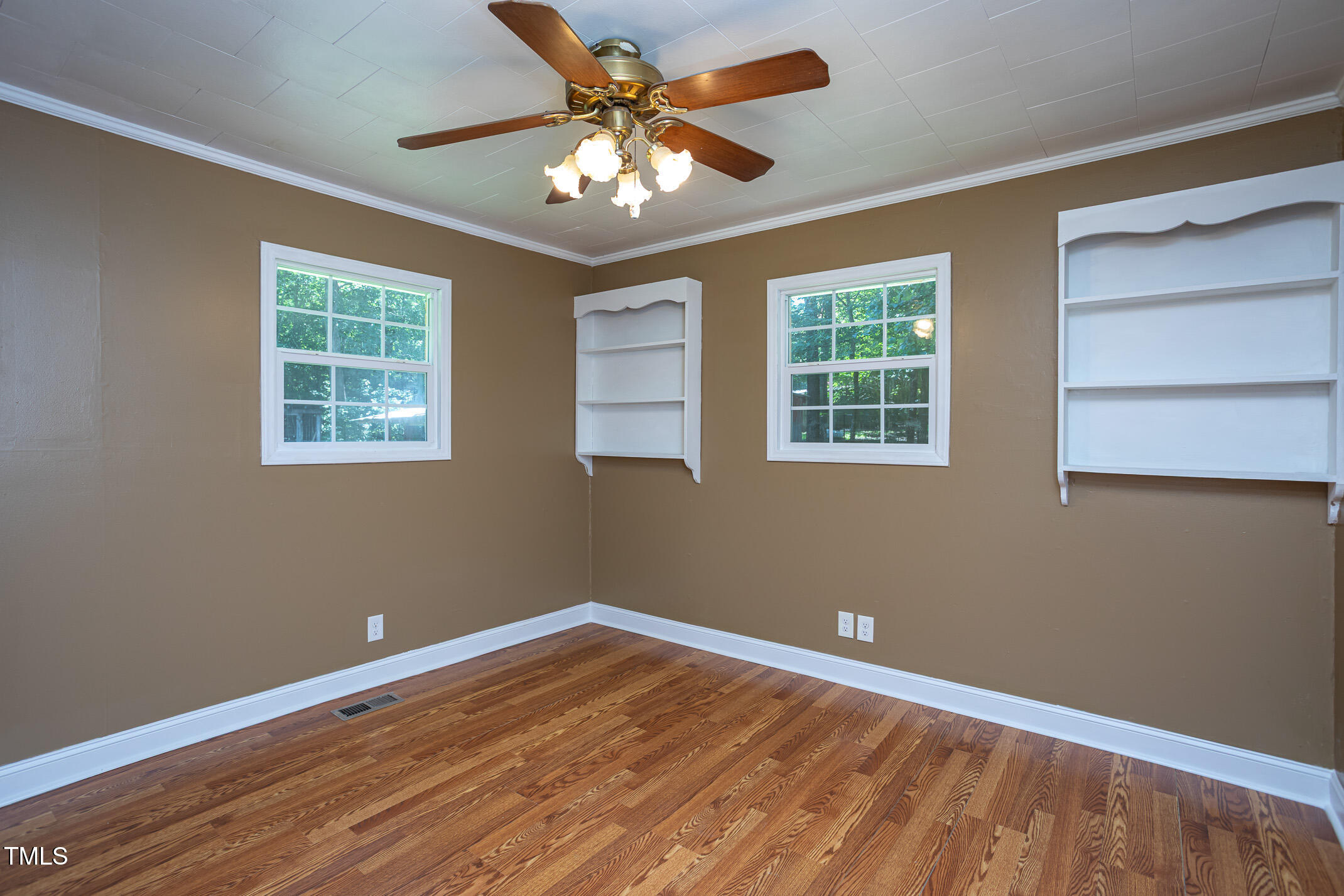 3622 Chestnut Ridge Church Road Efland, NC 27243 - Photo 11 of 22 a view of a room with wooden floor and windows