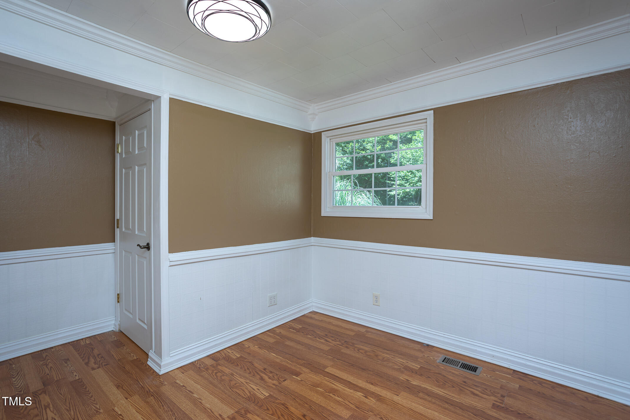 3622 Chestnut Ridge Church Road Efland, NC 27243 - Photo 12 of 22 an empty room with wooden floor and windows