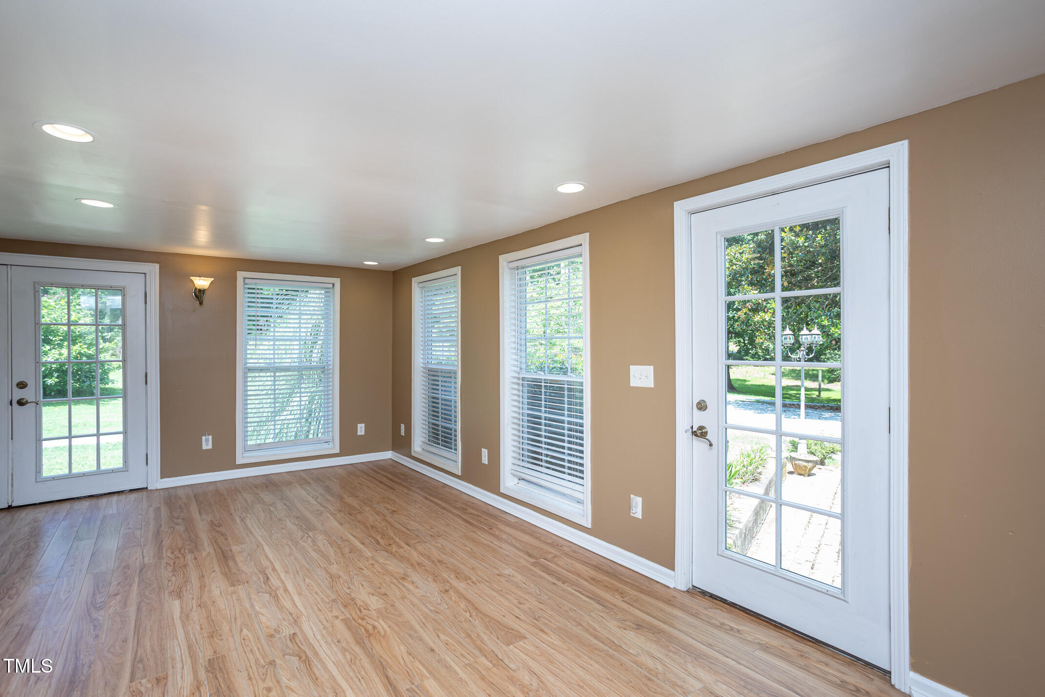 3622 Chestnut Ridge Church Road Efland, NC 27243 - Photo 14 of 22 a view of an empty room with wooden floor and a window