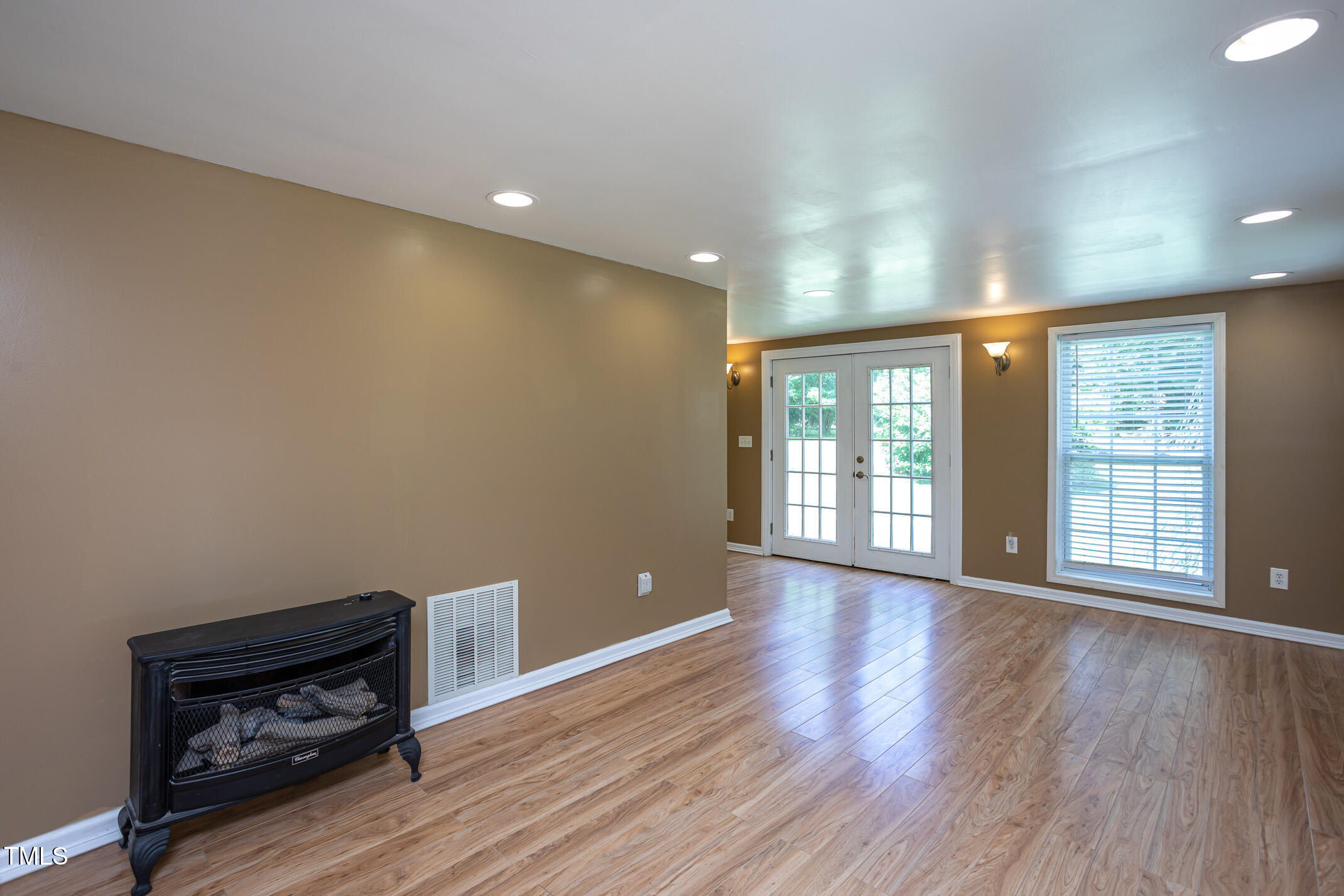 3622 Chestnut Ridge Church Road Efland, NC 27243 - Photo 15 of 22 a view of an empty room with wooden floor and a window
