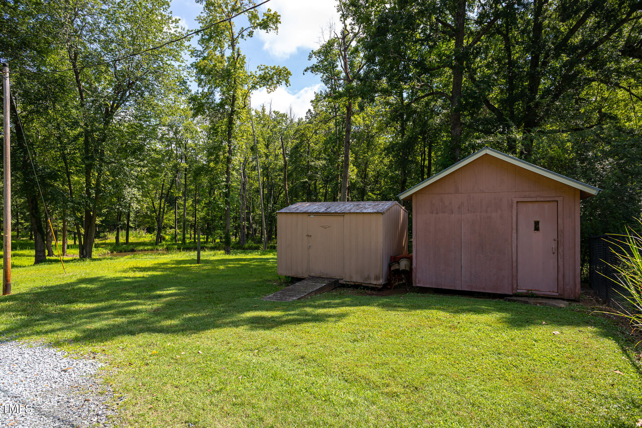 3622 Chestnut Ridge Church Road Efland, NC 27243 - Photo 19 of 22 a view of a backyard with a barn