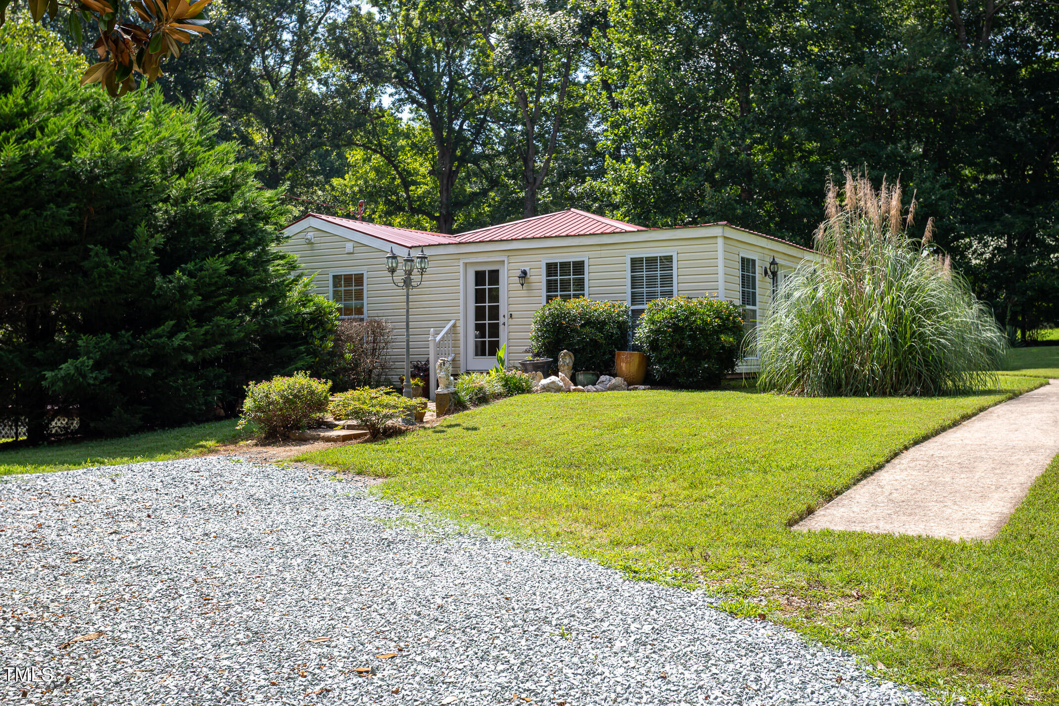 3622 Chestnut Ridge Church Road Efland, NC 27243 - Photo 2 of 22 a front view of a house with yard and green space