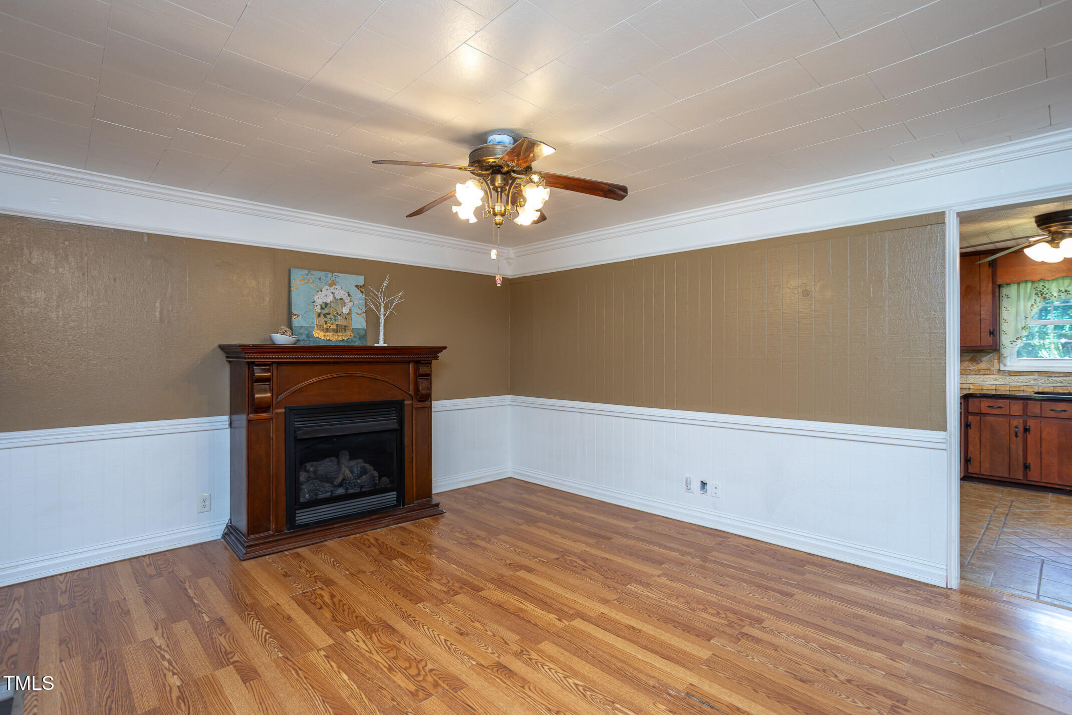 3622 Chestnut Ridge Church Road Efland, NC 27243 - Photo 3 of 22 a view of empty room with wooden floor and fan