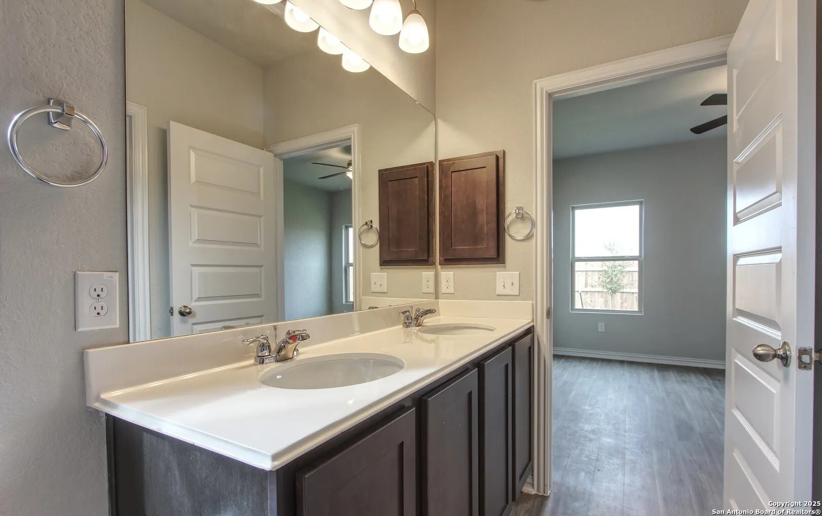 5423 Devils Gate Converse, TX 78109 - Photo 14 of 17 a bathroom with a sink double vanity granite and a mirror