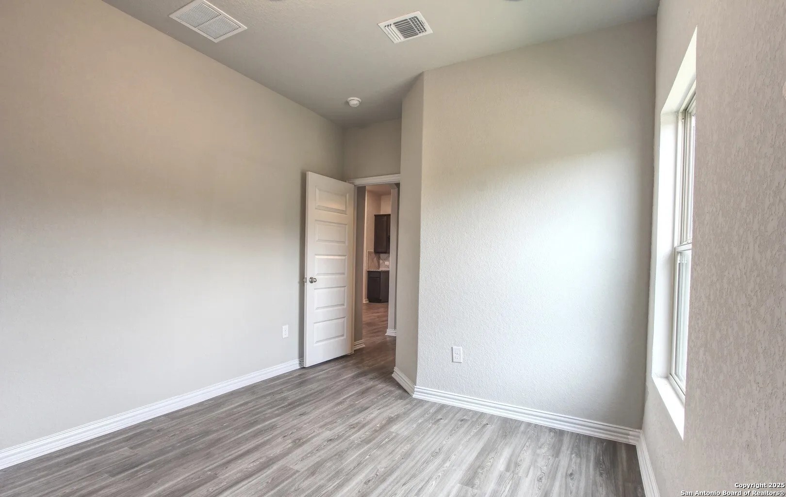 5423 Devils Gate Converse, TX 78109 - Photo 17 of 17 a view of an empty room with wooden floor and closet