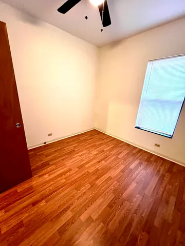 a view of room with wooden floor
