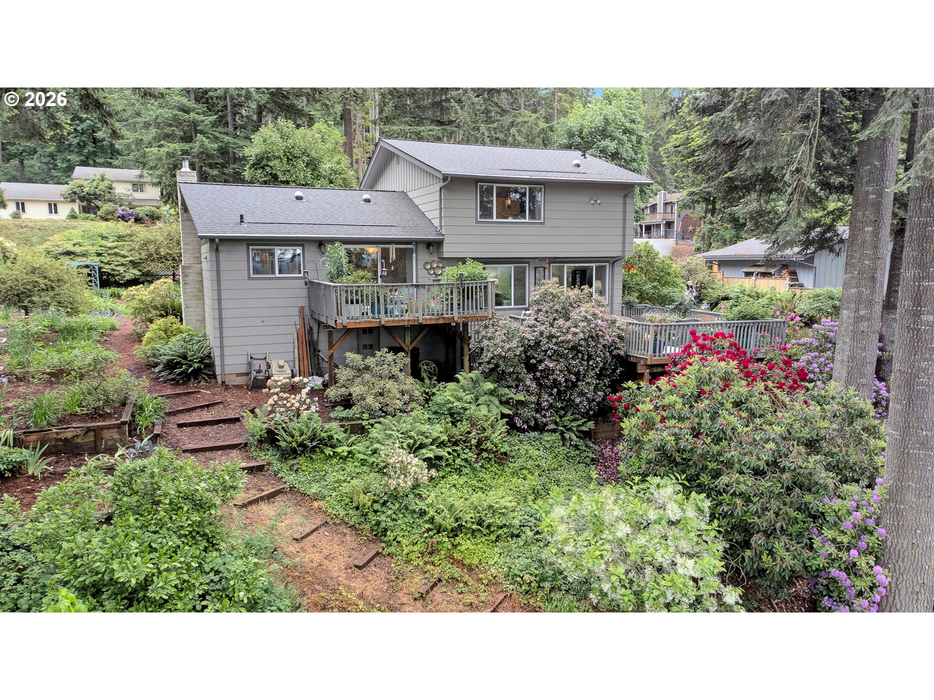 88108 Tiki Lane Springfield, OR 97478 - Photo 45 of 48 a view of a house with a small yard and plants
