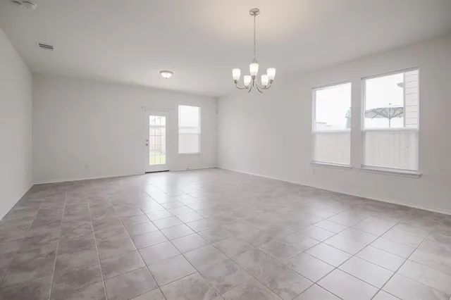 a view of empty room with windows