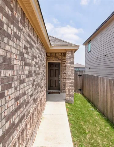 a view of a pathway both side of house