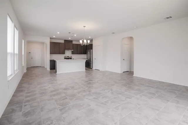 a view of a living room hardwood and kitchen