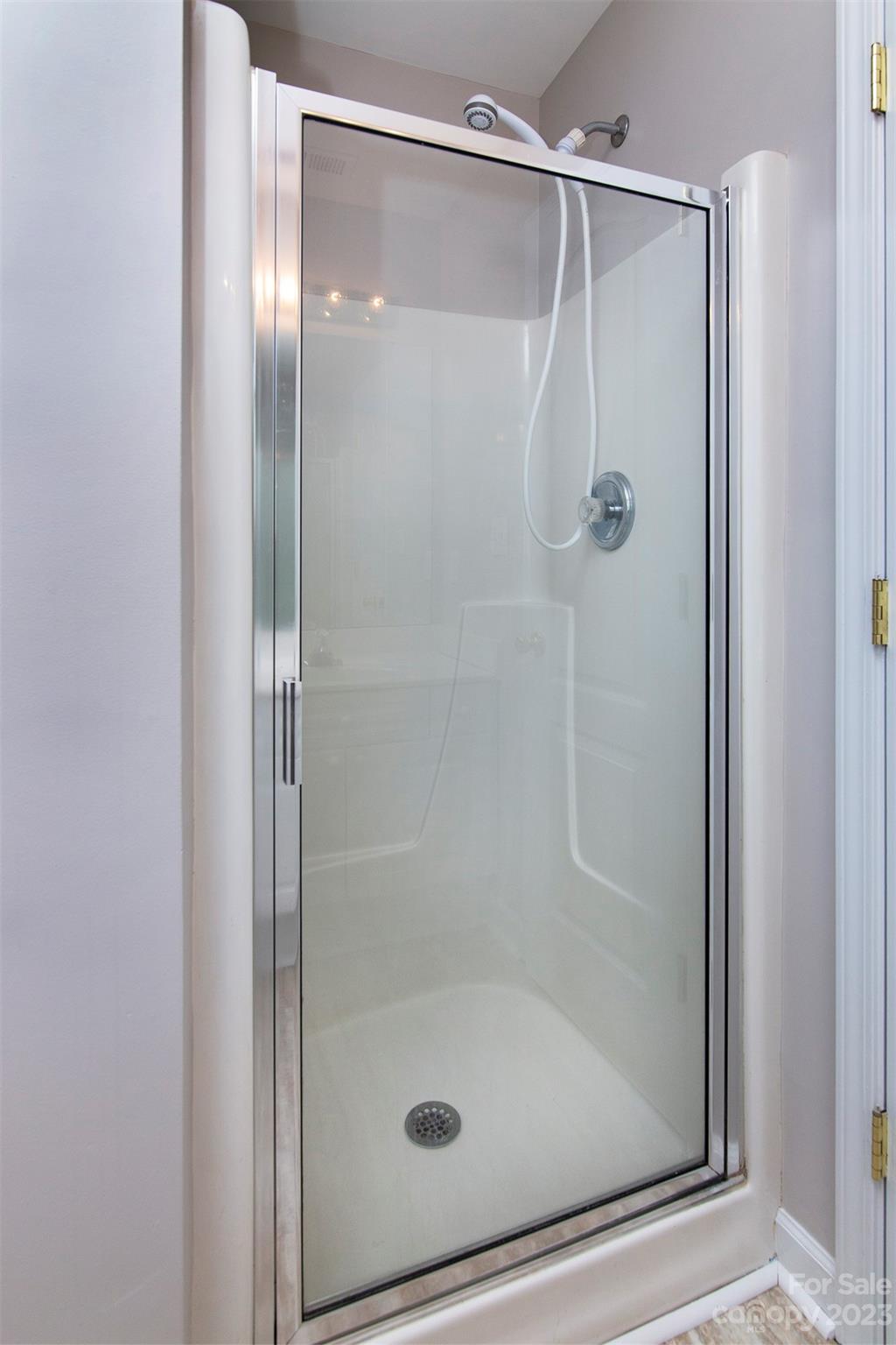 13111 Meadowmere Road Huntersville, NC 28078 - Photo 16 of 21 a bathroom with a glass shower door