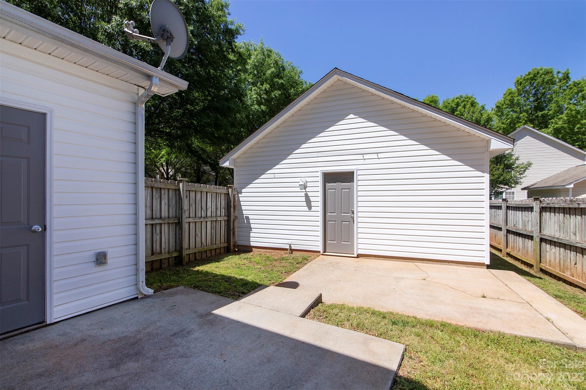 13111 Meadowmere Road Huntersville, NC 28078 - Photo 18 of 21 a view of a house with a yard and garage