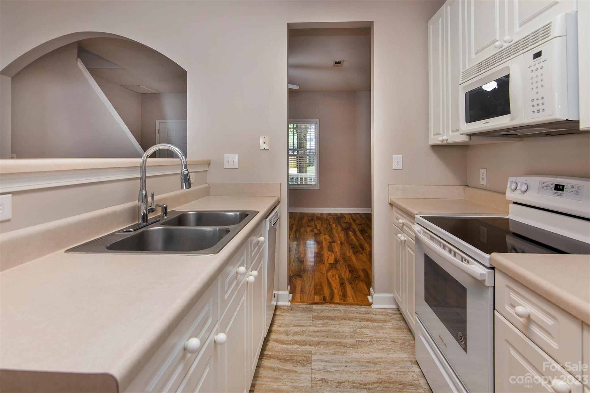 13111 Meadowmere Road Huntersville, NC 28078 - Photo 9 of 21 a kitchen with stainless steel appliances granite countertop a sink and a stove