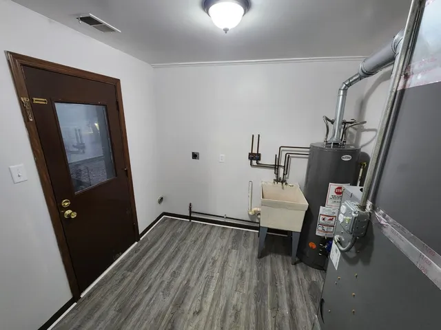 a view of entryway with wooden floor