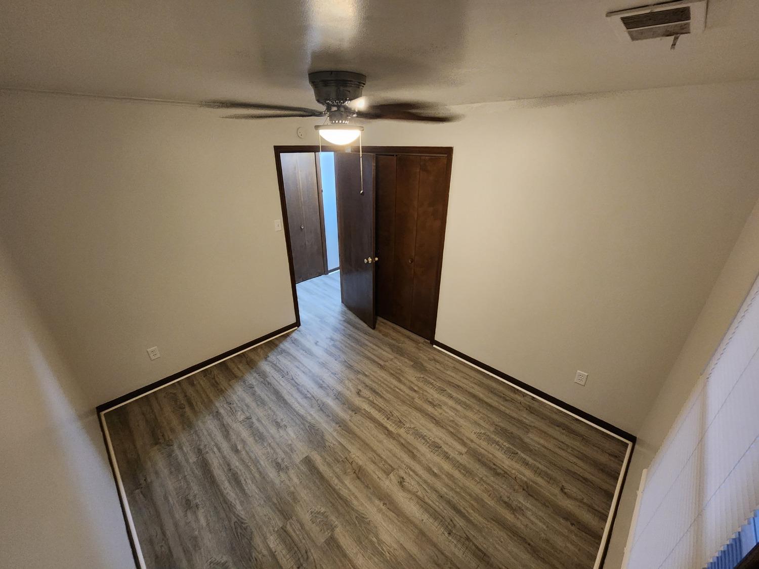 812 West Daumer Road, Unit C1 Kouts, IN 46347 - Photo 16 of 19 a view of a hallway with wooden floor and staircase