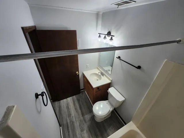 a bathroom with a toilet and a sink