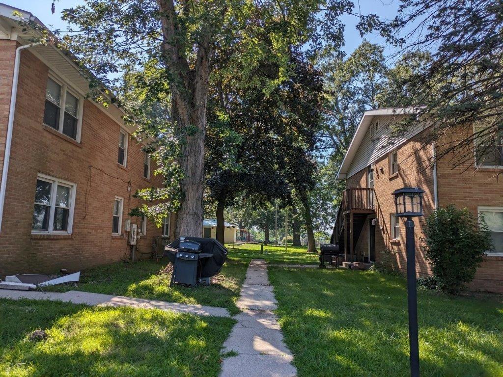 812 West Daumer Road, Unit C1 Kouts, IN 46347 - Photo 3 of 19 a view of a yard in front of a house