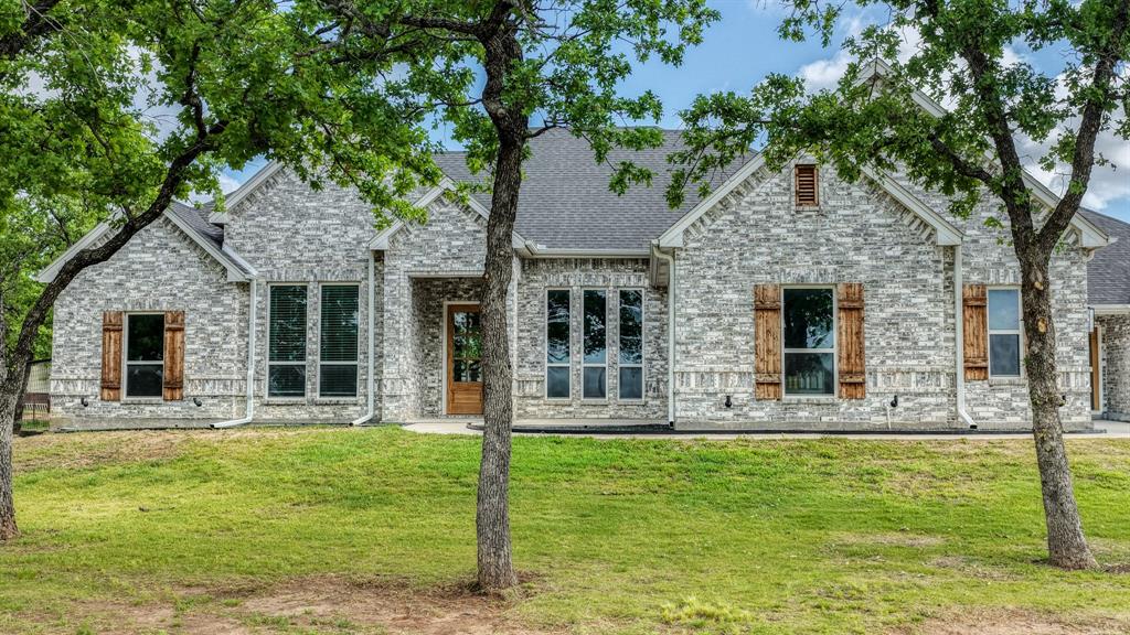 115 Post Oak Way Weatherford, TX 76087 - Photo 1 of 39 View of front facade featuring a front yard and brick siding