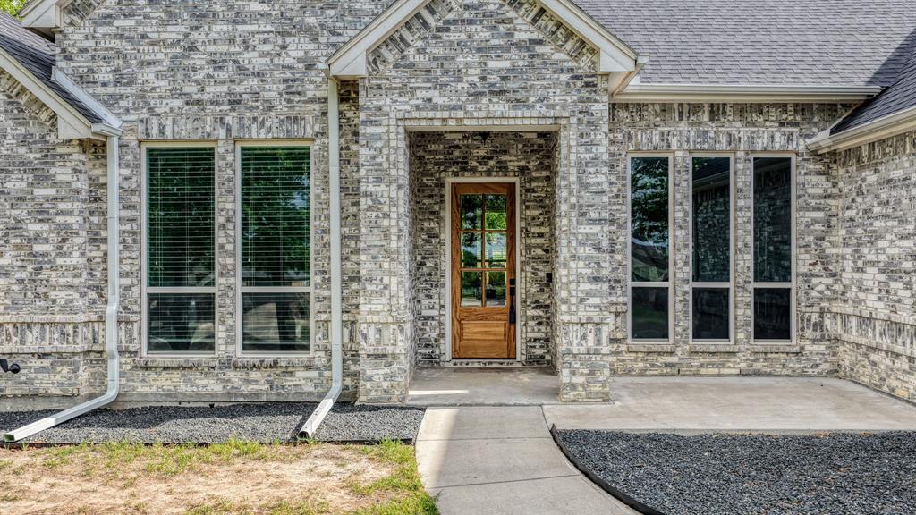 115 Post Oak Way Weatherford, TX 76087 - Photo 2 of 39 Entrance to property featuring brick siding