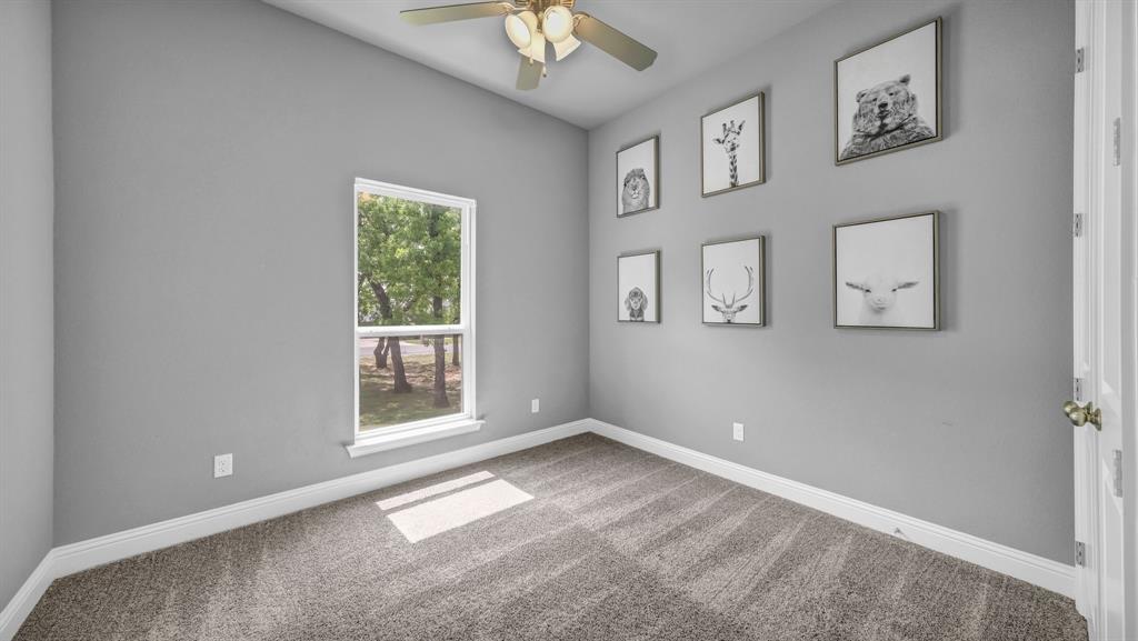 115 Post Oak Way Weatherford, TX 76087 - Photo 20 of 39 Unfurnished room with ceiling fan and carpet floors