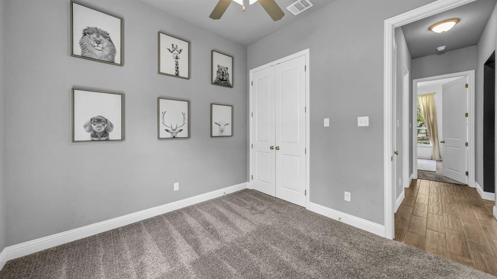 115 Post Oak Way Weatherford, TX 76087 - Photo 21 of 39 Unfurnished bedroom featuring carpet, a closet, and ceiling fan