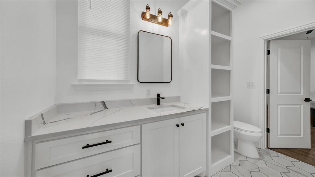 115 Post Oak Way Weatherford, TX 76087 - Photo 29 of 39 Bathroom featuring vanity and toilet