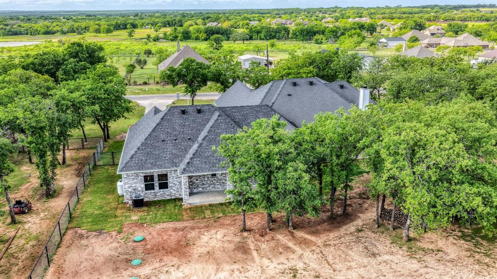 115 Post Oak Way Weatherford, TX 76087 - Photo 33 of 39 Aerial view of property and surrounding area featuring a tree filled landscape